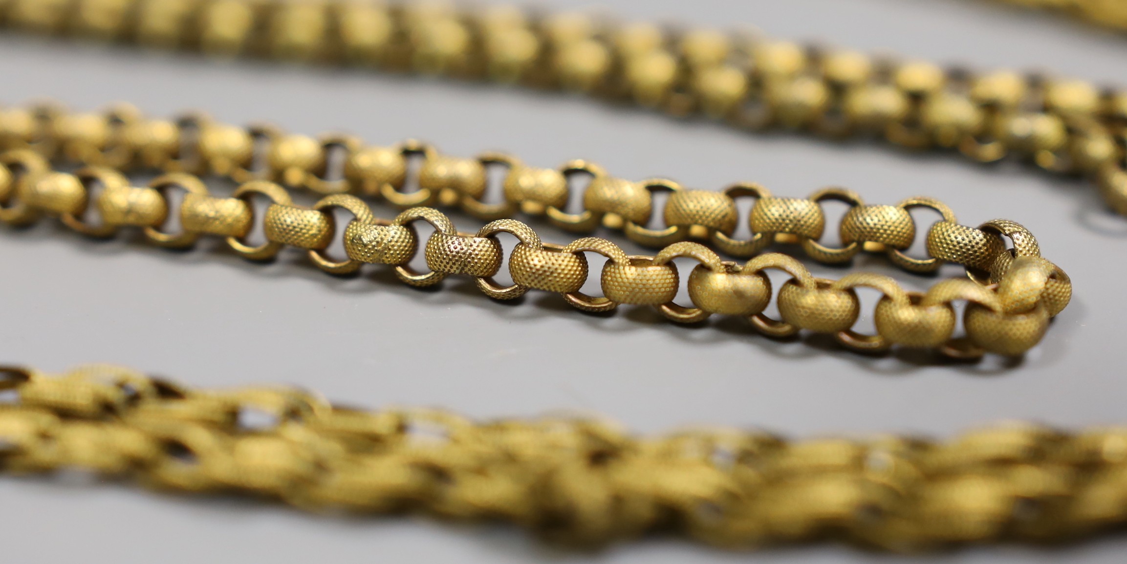 Two 19th century pinchbeck guard chains, longest 118 cm(a.f.)